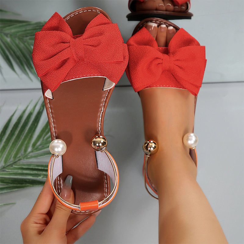 Sandalias planas para mujer con lazo decorativo y perlas elegantes