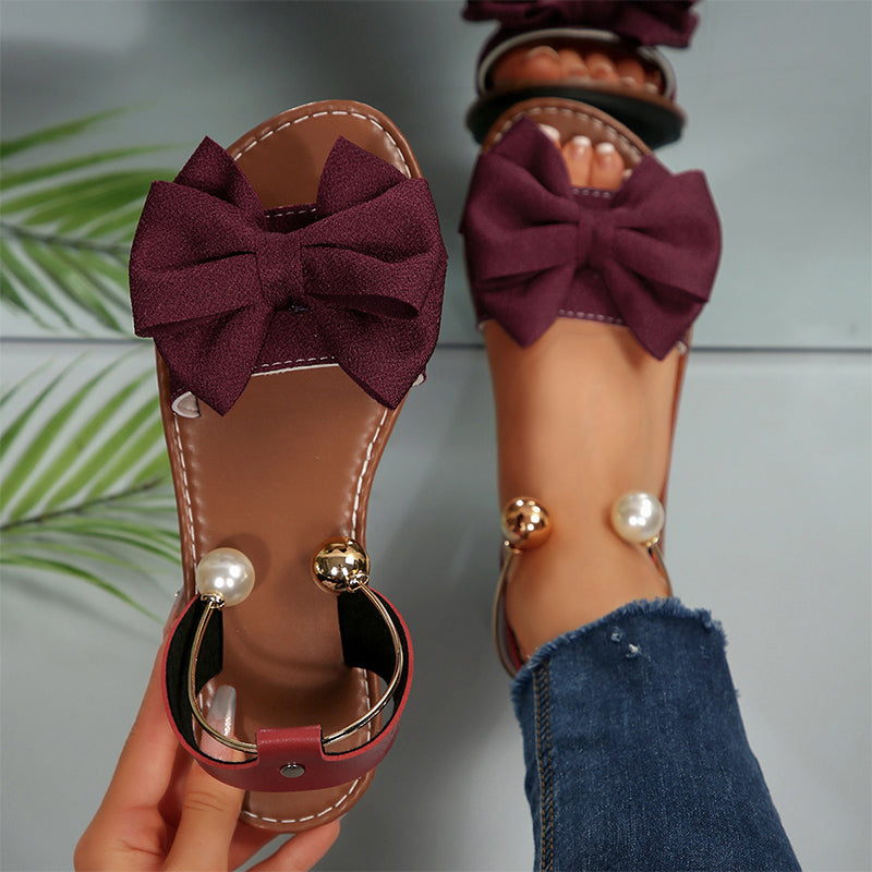 Sandalias planas para mujer con lazo decorativo y perlas elegantes