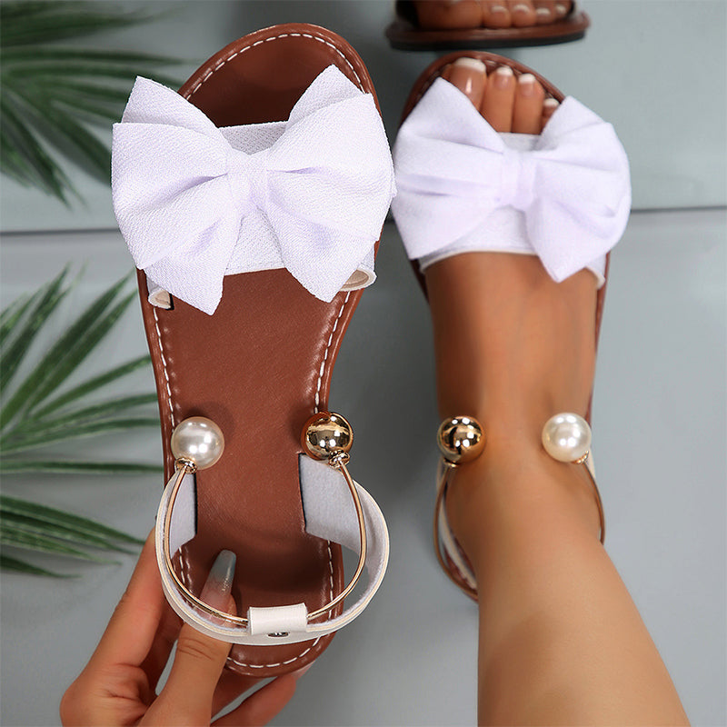 Sandalias planas para mujer con lazo decorativo y perlas elegantes
